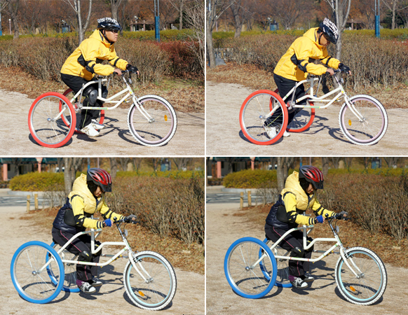 전형적 스타일 사진(페트라 자전거를 타고 몸을 앞으로 기울인 남자와 여자 모습)